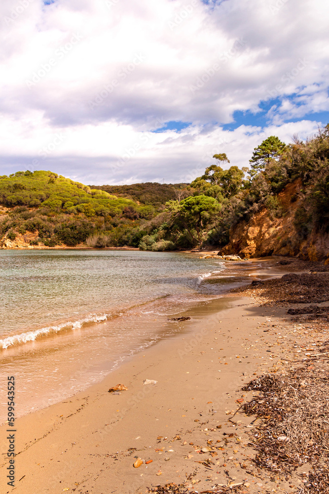 Magazzini Beach, a free mixed shingle and sand beach situated in the gulf of Portoferraio, Elba island, Italy Magazzini Beach, a free mixed shingle and sand beach situated in the gulf of Portoferraio, Elba island, Italy