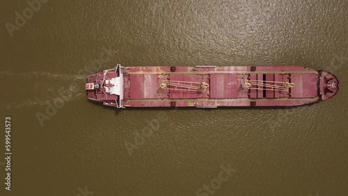 Overhead Shot Of Bulk Carrier Cargo Ship Sailing In Parana River, Hidrovia, Argentina photo