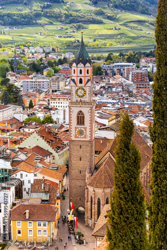 View over cityscape with Cathedral Saint Nikolaus of Merano, South tyrol, Italy seen from famous hiking trail Tappeinerweg