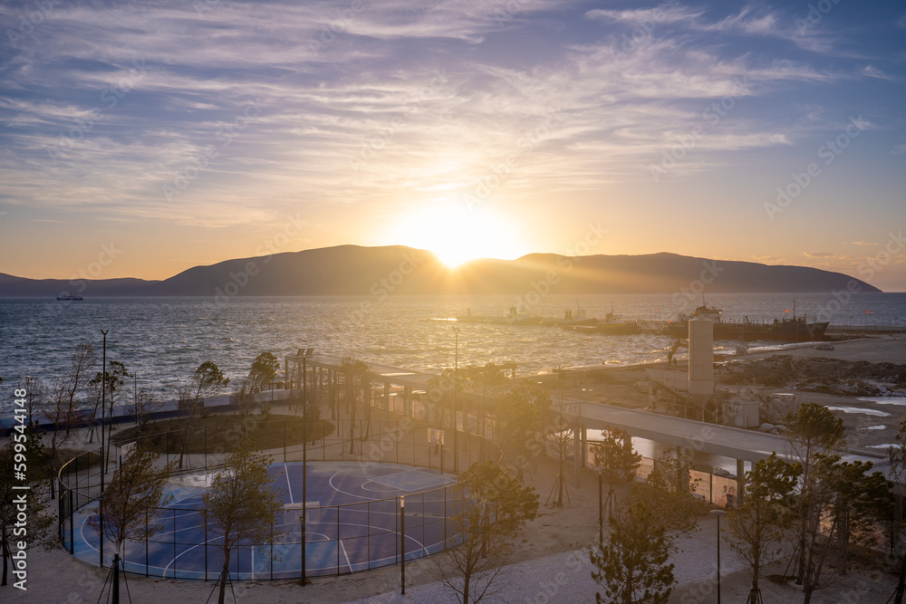 Fototapeta premium Sunset Over the Sea with Fishing Boat , Beautiful Nature Background from Vlore, Albania