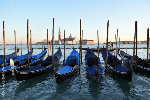Gondolas standing on the pier in the Italian city of Venice