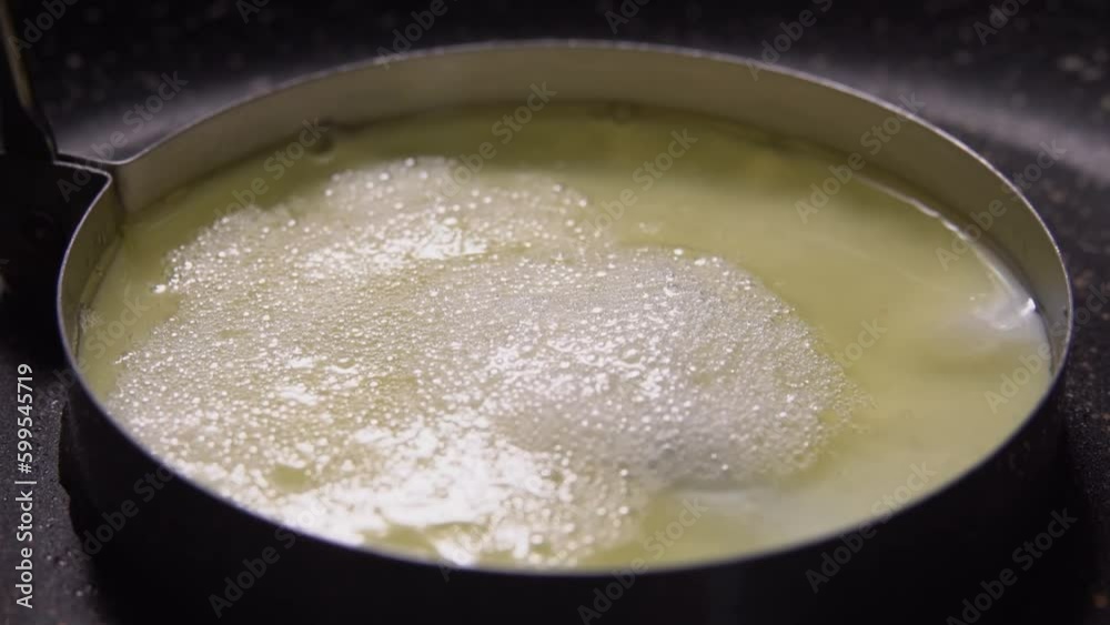 Protein is fried in molds in a pan Protein is fried in molds in a pan