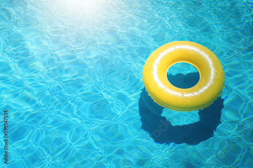 Summer Yellow Swimming Pool Ring Float in Blue Water. created with Generative AI