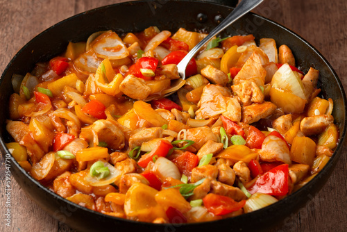 Sweet and sour chicken with colorful bell pepper on a plate. Chinese Asian style Food dish