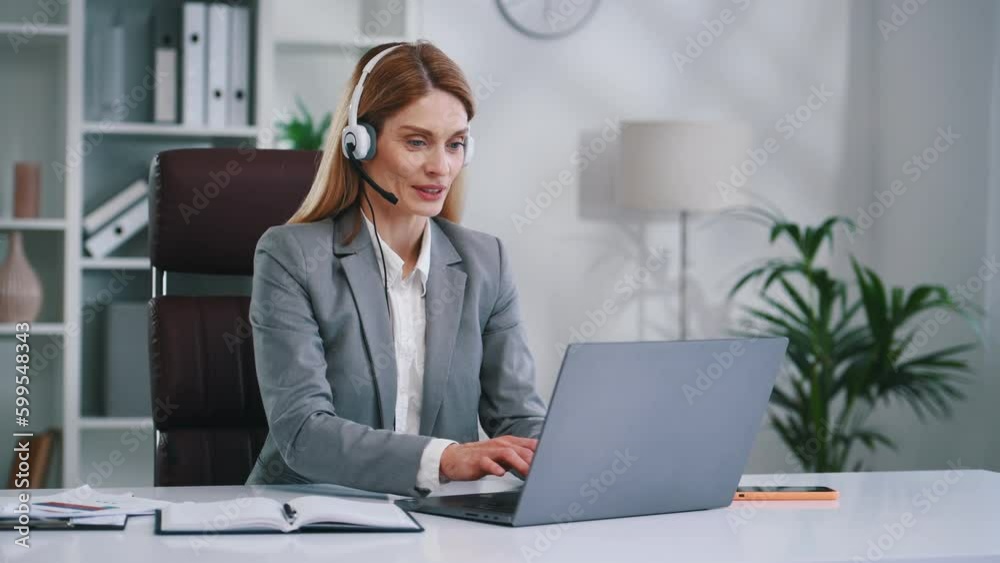 Call center, in headphones. Woman in business formal clothes is working in office. Call center, in headphones. Woman in business formal clothes is working in office.