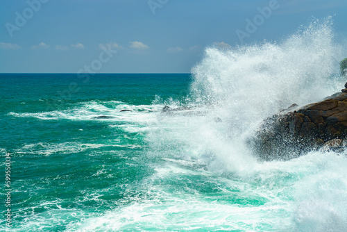 Splashes of waves crashing against the rocks