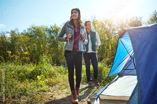 All good things are wild and free. an adventurous young couple at their campsite.