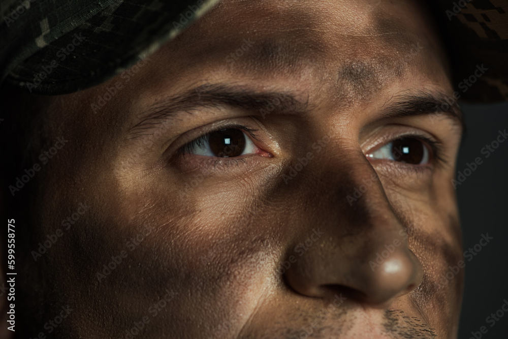 close up view of eyes of military man with dirt on face suffering from ptsd  isolated on grey. Stock Photo | Adobe Stock