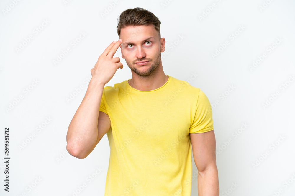 Young blonde caucasian man isolated on white background with problems making suicide gesture Young blonde caucasian man isolated on white background with problems making suicide gesture