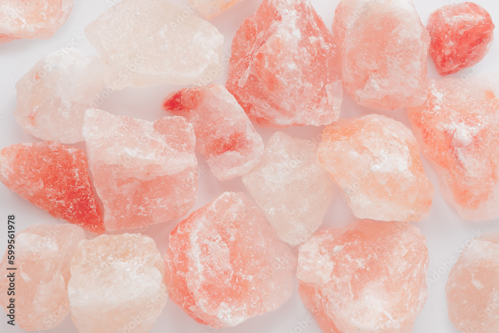 Raw rose quartz crystal stones on white Raw rose quartz crystal stones on white