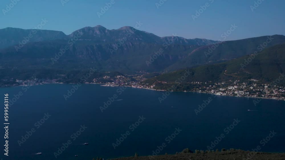 Dramatic Scene Of The Bay Of Kotor With Sailing Boats And Small Village On Mountains In Montenegro. aerial Dramatic Scene Of The Bay Of Kotor With Sailing Boats And Small Village On Mountains In Montenegro. aerial
