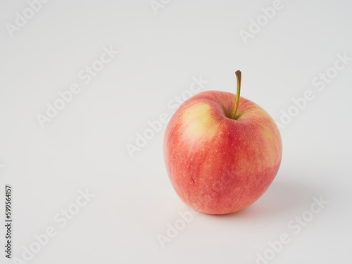 A red apple isolated on a white background with a cropped outline and full depth of field