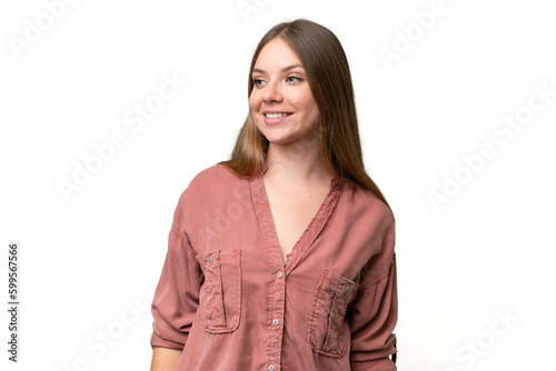 Young beautiful blonde woman over isolated background looking to the side and smiling