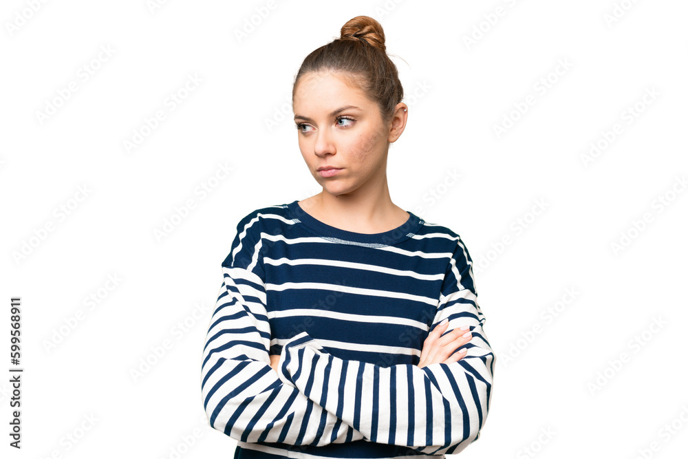 Young blonde woman over isolated chroma key background keeping the arms crossed Young blonde woman over isolated chroma key background keeping the arms crossed