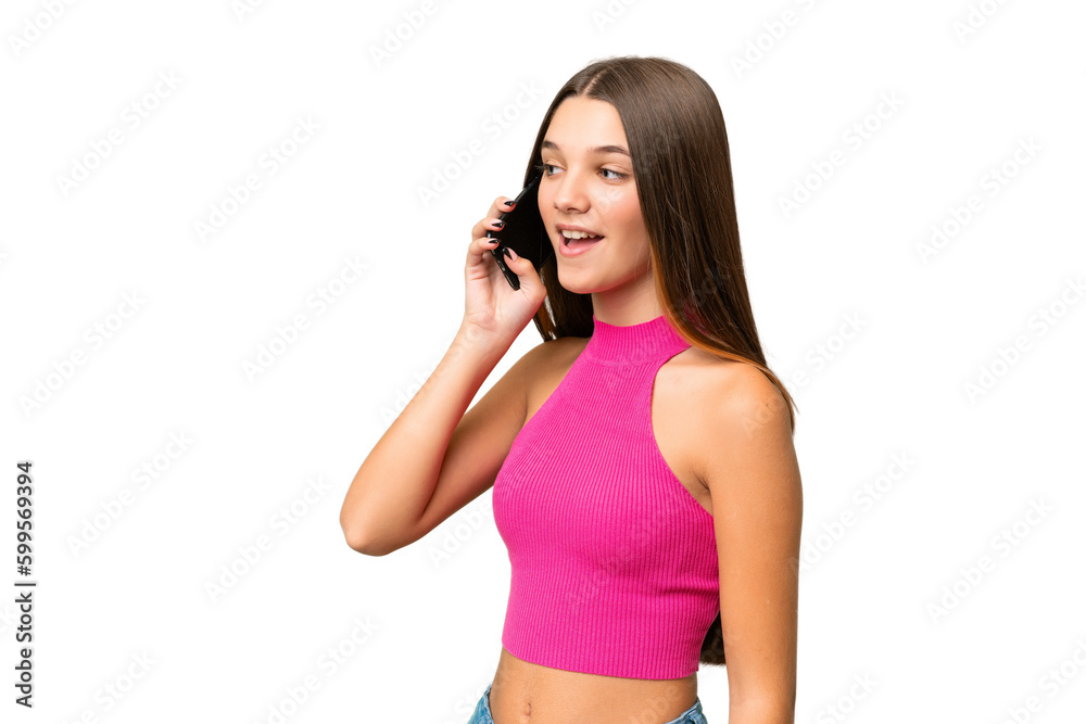 Teenager caucasian girl over isolated background keeping a conversation with the mobile phone Teenager caucasian girl over isolated background keeping a conversation with the mobile phone