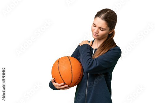 Teenager caucasian girl playing basketball over isolated background suffering from pain in shoulder for having made an effort