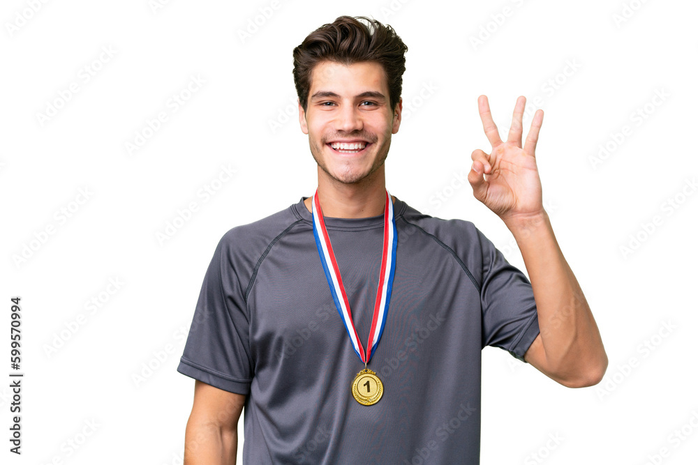 Young caucasian man with medals over isolated background happy and counting three with fingers Young caucasian man with medals over isolated background happy and counting three with fingers