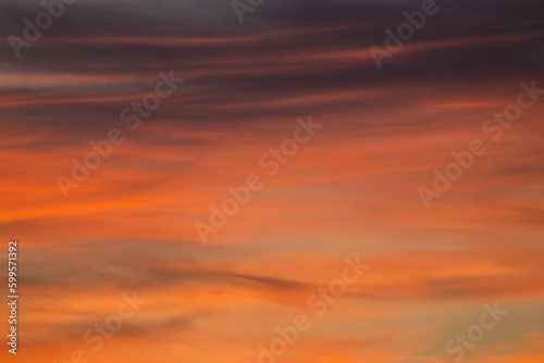 Beautiful clouds in the sunset light. Abstract composition of dramatic sky. © avs_lt