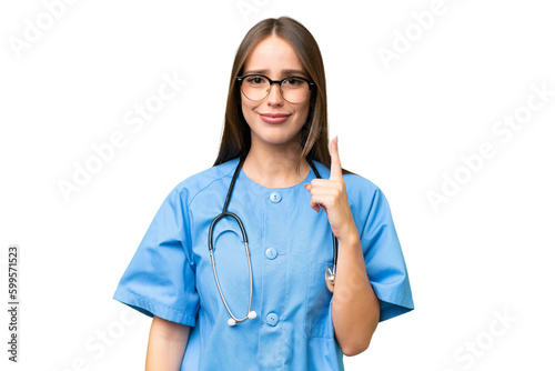 Young nurse caucasian woman over isolated background pointing with the index finger a great idea