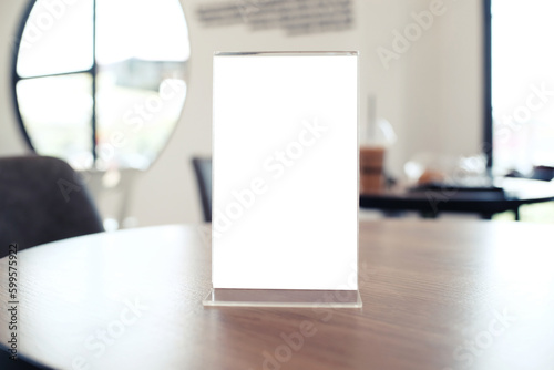 Menu frame standing on wood table in Bar restaurant cafe. space for text marketing promotion.