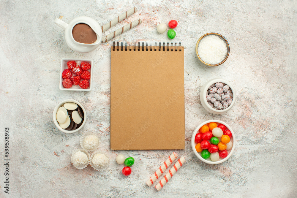 top view colorful candies with cookies on white background color rainbow biscuit tea cake top view colorful candies with cookies on white background color rainbow biscuit tea cake