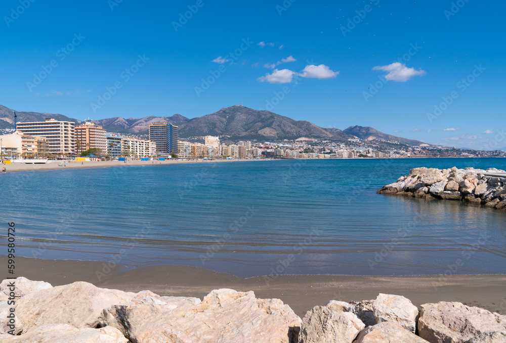 Fuengirola view Spain from Playa los Boliches to the mountains with blue Mediterranean sea and sky
