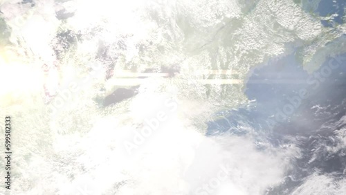 Earth zoom in from outer space to city. Zooming on Elmira, New York, USA. The animation continues by zoom out through clouds and atmosphere into space. Images from NASA photo