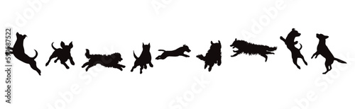 Set of vector silhouette of jumping dogs on white background.