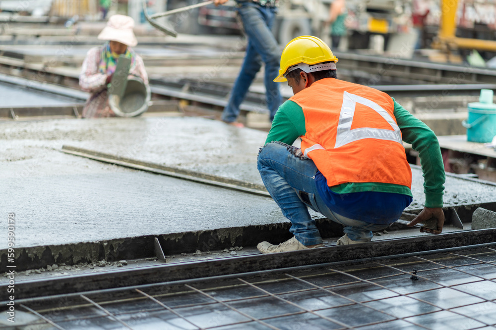 Male worker in a precast wall factory (Precast) is forming a wall with cement. and smooth the plaster in the prepared mold Male worker in a precast wall factory (Precast) is forming a wall with cement. and smooth the plaster in the prepared mold