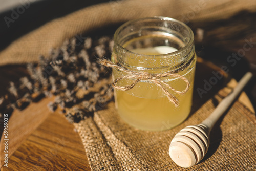 Sweet honey, wooden spoon and lavender, rural aesthetic