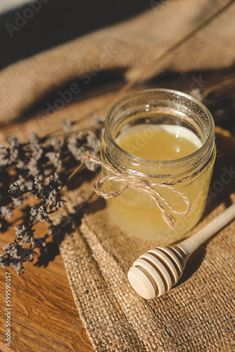 Sweet honey, wooden spoon and lavender, rural aesthetic