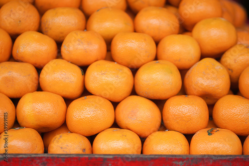 Pile of Sunkist oranges being sold in a fruit shop. photo