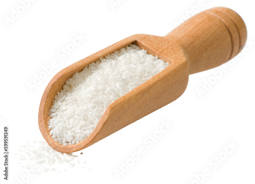 Shredded coconut in the wooden scoop isolated on the white background.