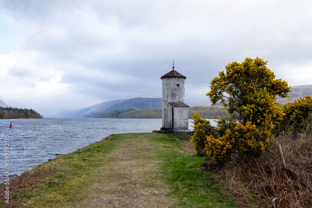 Old lighthouse near gairnlochy bridge overlooking Loch Lochy