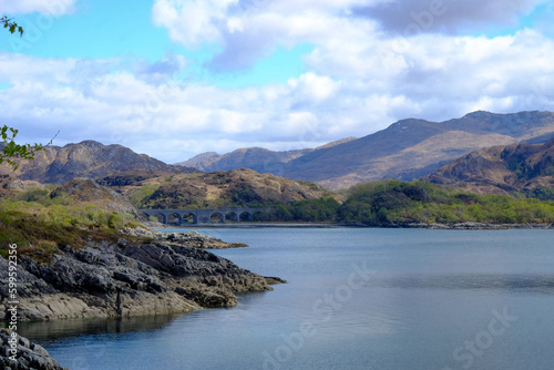 View of the Glenfinnan viaduct and the old railway in the Scottish highlands