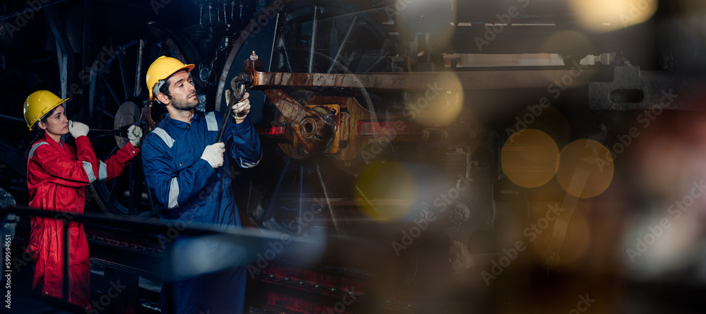 Team of engineer railway wearing safety uniform and helmet under checking under train ,wheels and control system for safety travel passenger. Banner cover design. Team of engineer railway wearing safety uniform and helmet under checking under train ,wheels and control system for safety travel passenger. Banner cover design.