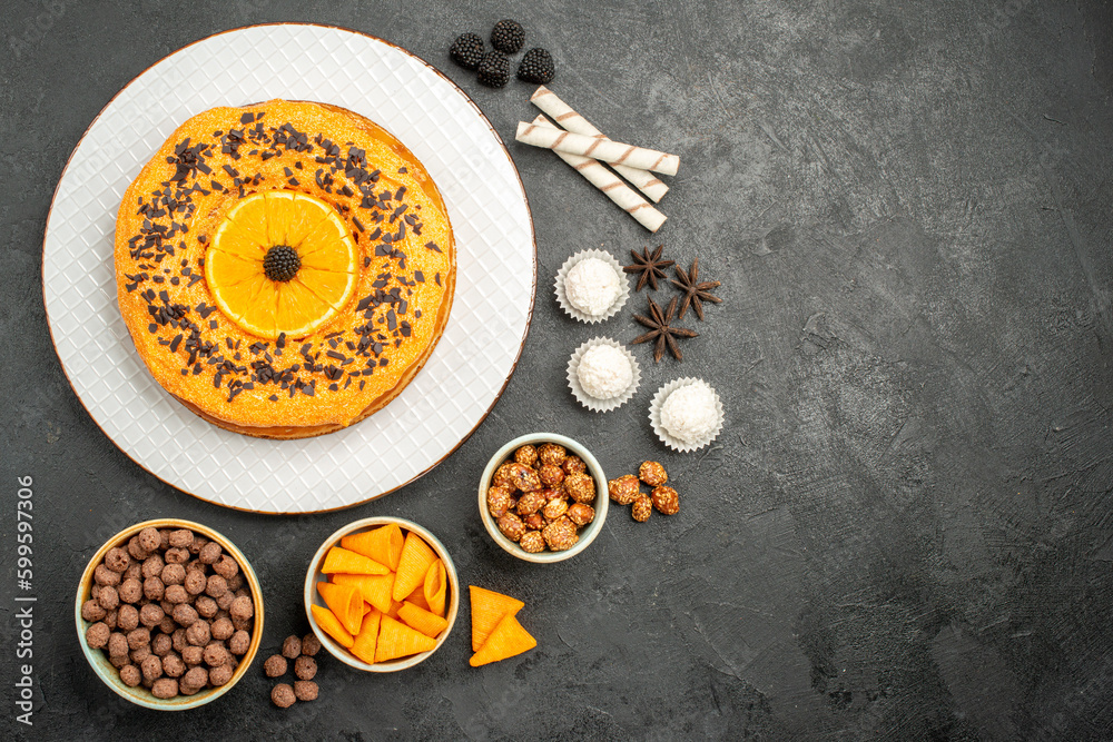 top view delicious sweet pie with orange slices on dark-grey background fruit pie cake dough biscuit