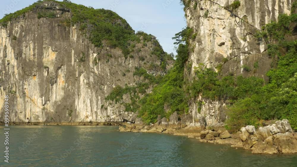 Sailing past some of the many tropical islands of Halong Bay Vietnam. Sailing past some of the many tropical islands of Halong Bay Vietnam.