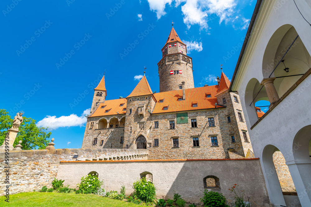 Fototapeta premium Famous medieval castle Bouzov, Czech Republic. National landmark built in 14 century. Famous tourist destination. Summer weather, blue sky.