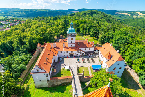 Famous medieval castle Bouzov, Czech Republic. National landmark built in 14 century. Famous tourist destination. Summer weather, blue sky. photo