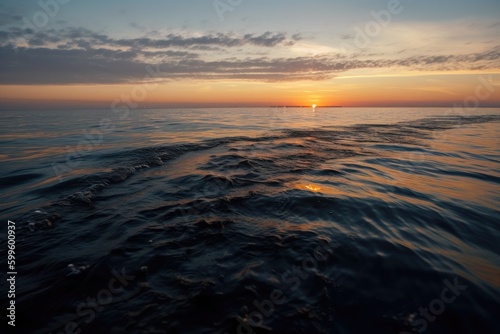oil slick on ocean surface  with distant view of sunset  created with generative ai
