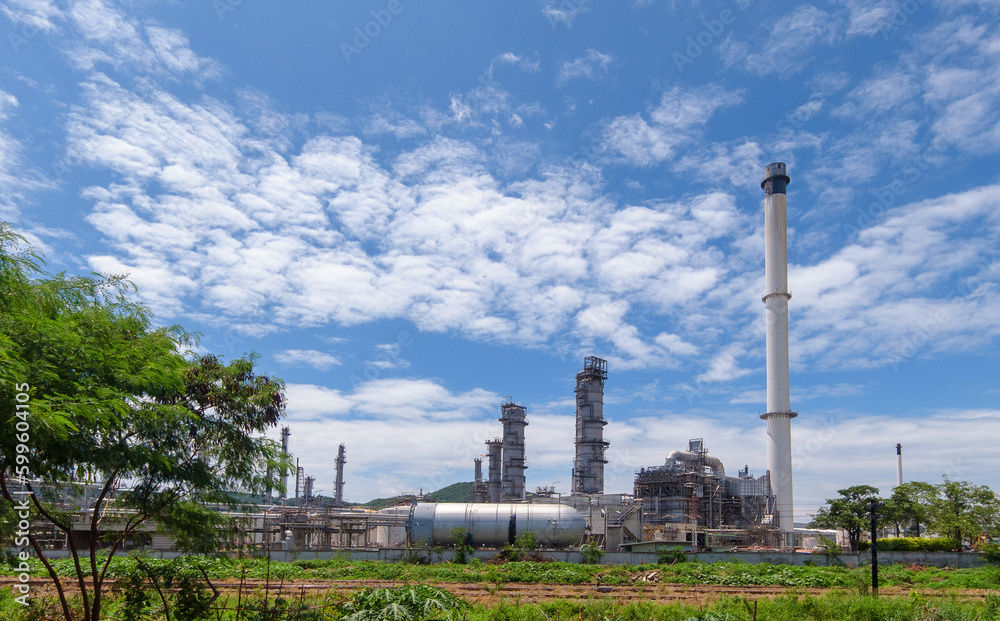 oil refinery plant against blue sky