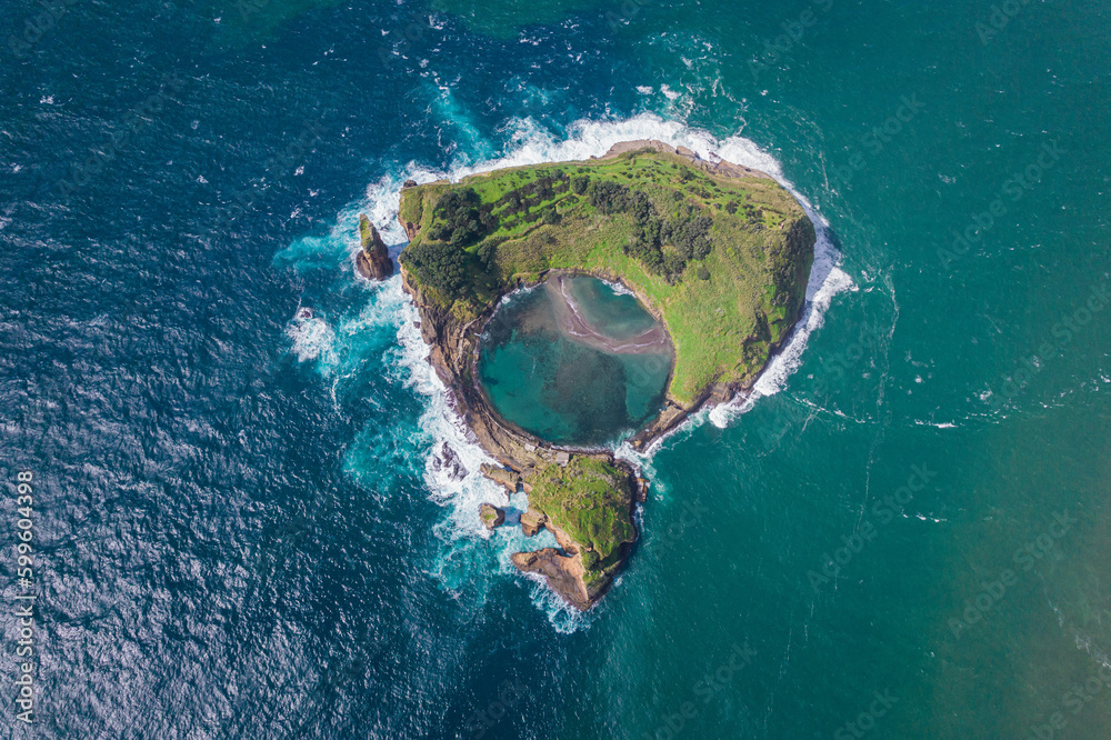 Fototapeta premium Azores aerial view. Top view of the Island of Vila Franca do Campo. Crater of an old underwater volcano on San Miguel island, Azores, Portugal.