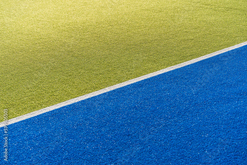 Sports court banner background. Colored artificial turf court in the stadium