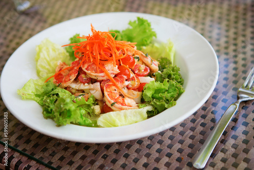 Delicious salad with prawns and vegeatables photo