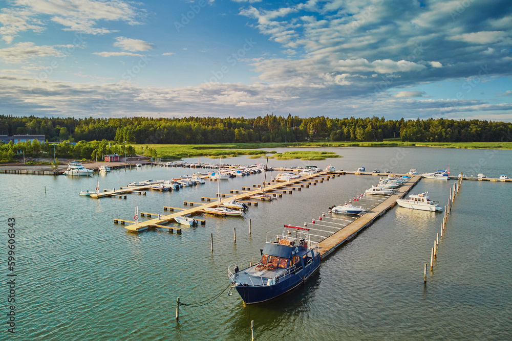 Scenic aerial view of colorful boats near wooden berth