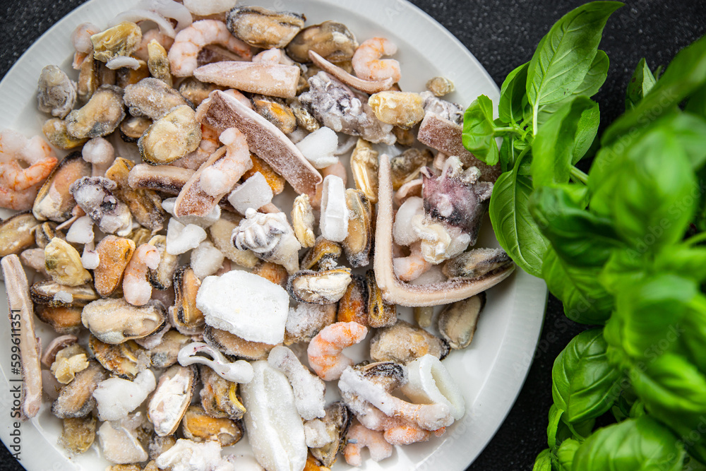 seafood salad frozen food mussels, rapan, octopus, scallop, squid healthy meal food snack on the table copy space food background rustic top view seafood salad frozen food mussels, rapan, octopus, scallop, squid healthy meal food snack on the table copy space food background rustic top view