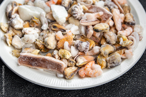 seafood salad frozen food mussels, rapan, octopus, scallop, squid healthy meal food snack on the table copy space food background rustic top view 
