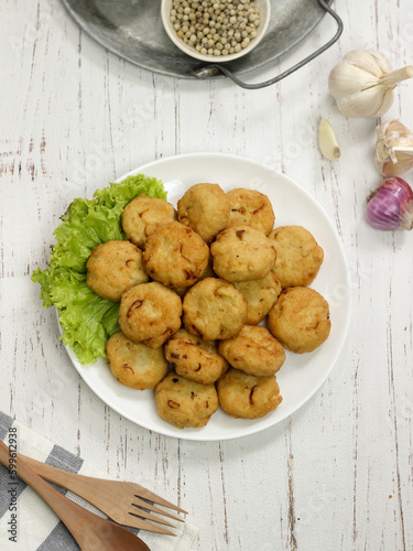 Perkedel tahu or fried tofu patties. Made of mixture mashed tofu, small amount of tapioca flour, spring onion, egg, salt and pepper and deep fried.
