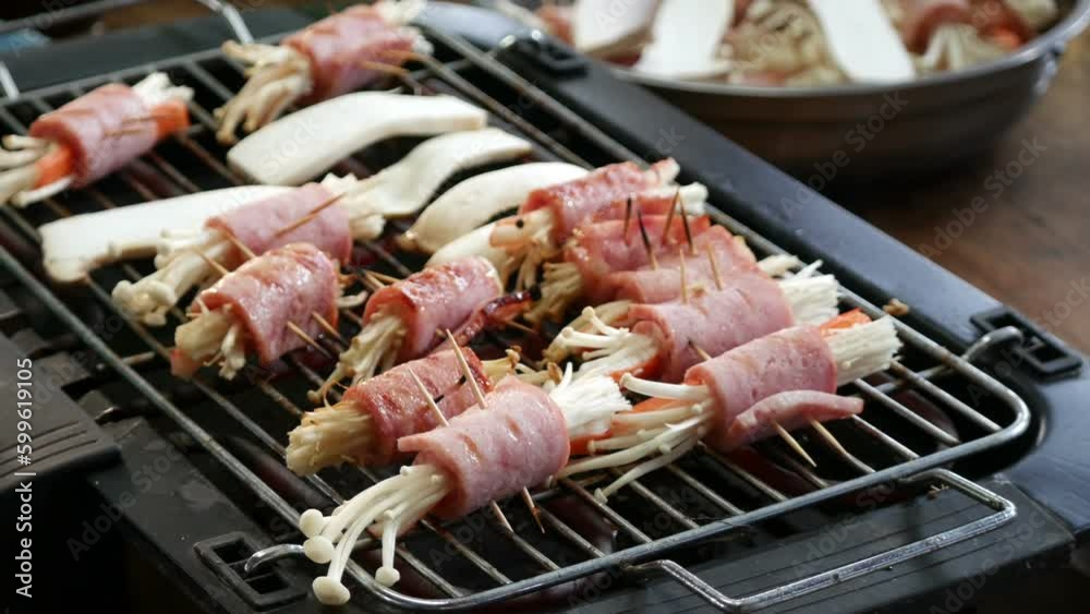 Mushroom wrapped with pork, ham, butter, grilled skewers